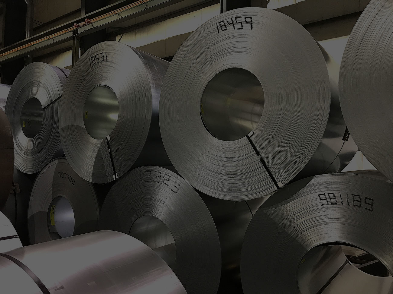 JMBurnsSteelrollscloseupstackedoverlay • JM Burns Steel Supply